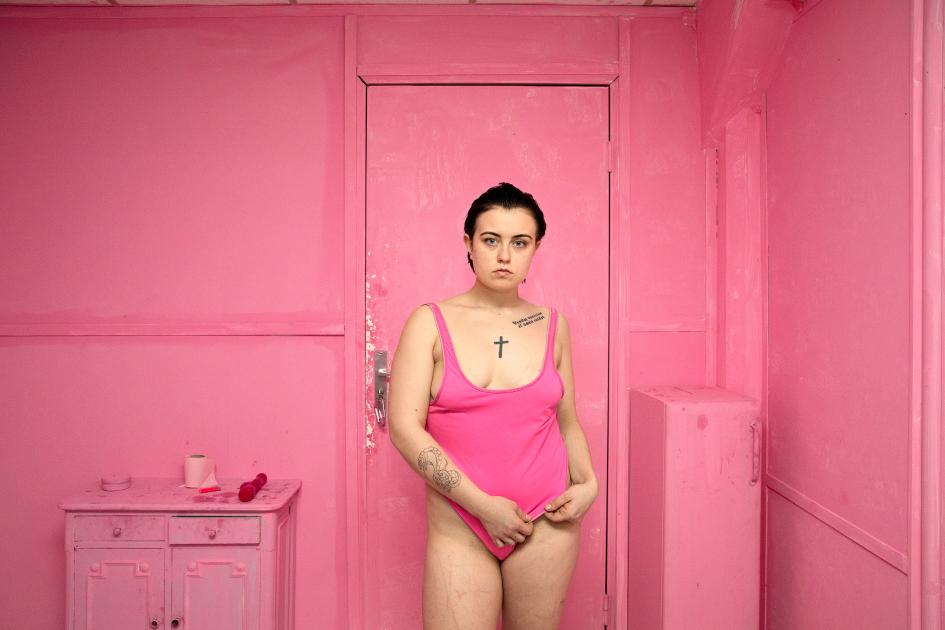 Agata Kay in a Pink bathing suite in a pink room in Paris, November 2nd, 2017. Photo taken by Bieke Depoorter